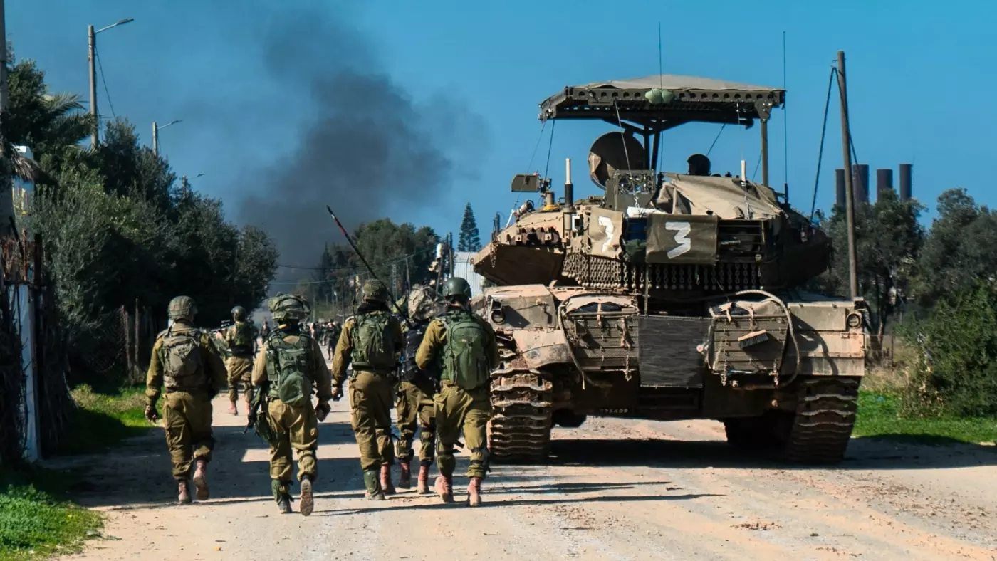 israel soldiers advance areas palestine gaza smoke rises air strikes 28 jan 2024 afp handout israeli army.jpg